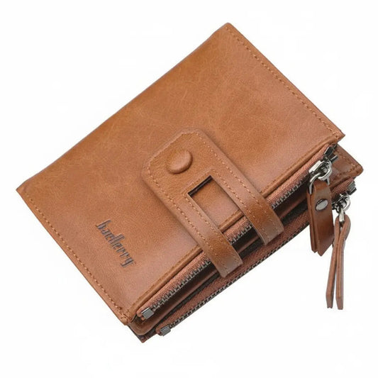 A brown faux-leather bi-fold wallet with a front strap closure, zippered card slots, and a hanging leather tassel charm, shown on a plain white background.