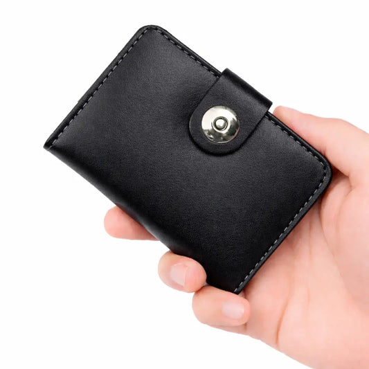Black leather wallet held in a hand against a white background