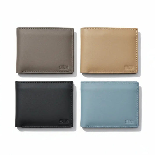 Four leather wallets in different colors on a white background