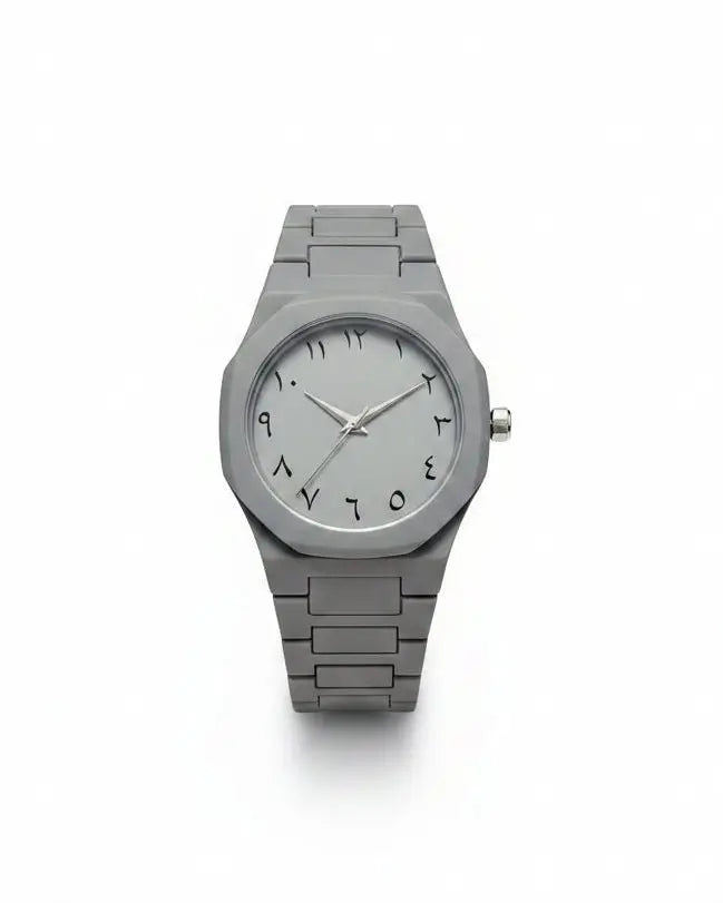 Silver watch with a metallic band on a white background