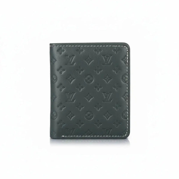 Green leather wallet with monogram pattern on a white background