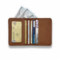 Brown leather wallet with cards and cash on a white background
