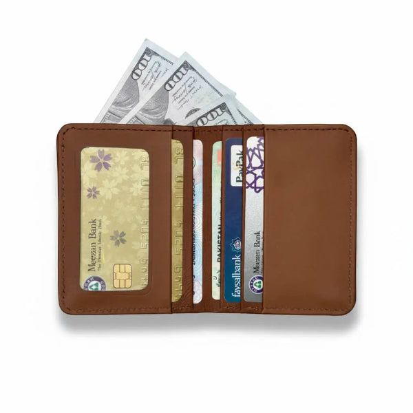 Brown leather wallet with cards and cash on a white background