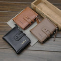Three small bifold wallets in black, tan, and brown leather are arranged on a wooden surface with a light wood box in the background. Each wallet has a snap tab closure, a zipper pocket, and the brand name 'butterfly' printed on the front.