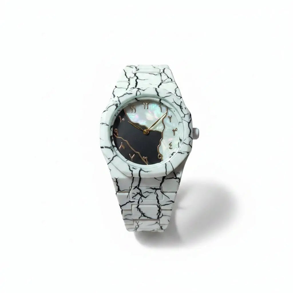 White marble-patterned watch on a stand with a blurred background